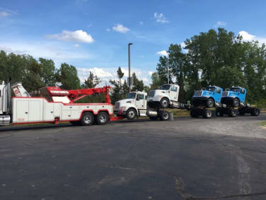 Sliding rotator towing decked tractors in Rochester -585-865-8159